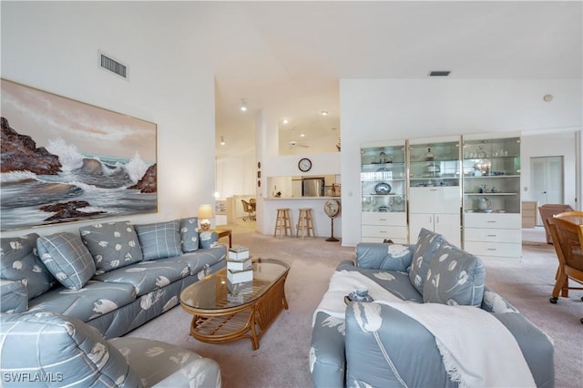 2141 Tama Cir Unit 202, Naples, FL 34112 - living room with carpet flooring and a towering ceiling