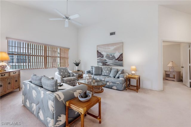 2141 Tama Cir Unit 202, Naples, FL 34112 - living area with light carpet, high vaulted ceiling, and a ceiling fan