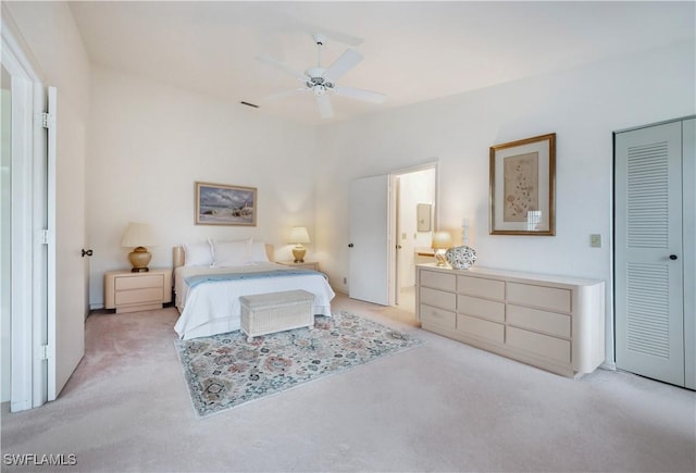 2141 Tama Cir Unit 202, Naples, FL 34112 - bedroom with light colored carpet, a closet, and ceiling fan