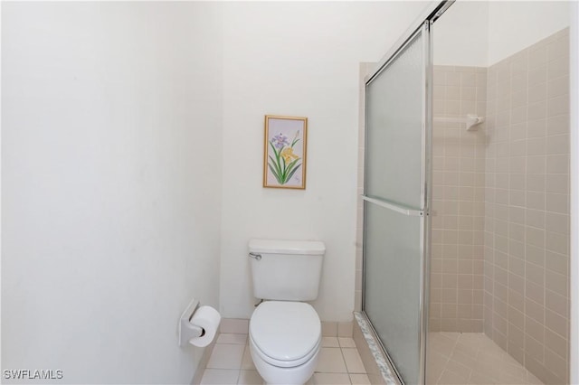 2141 Tama Cir Unit 202, Naples, FL 34112 - full bath with a shower stall, tile patterned floors, and toilet