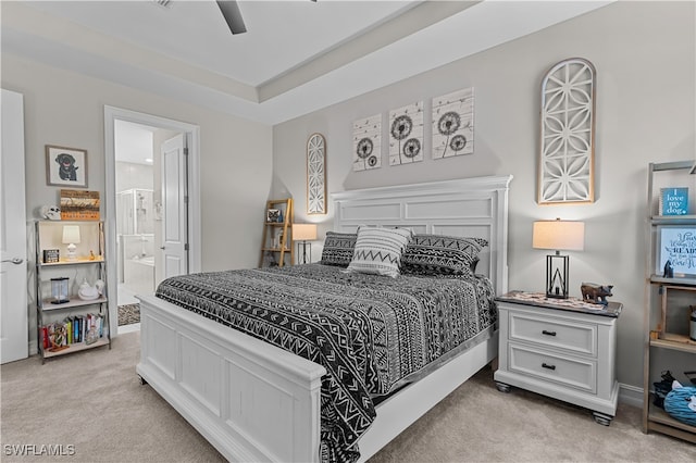 carpeted bedroom featuring ensuite bathroom and ceiling fan