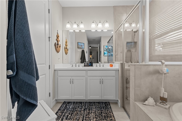 bathroom with vanity and a shower with shower door