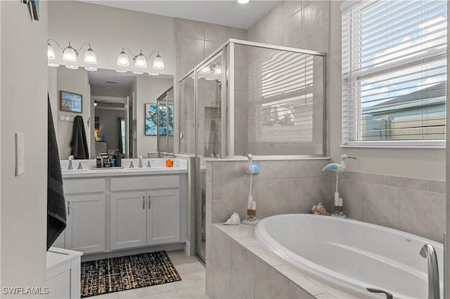 bathroom featuring vanity, shower with separate bathtub, and tile patterned flooring