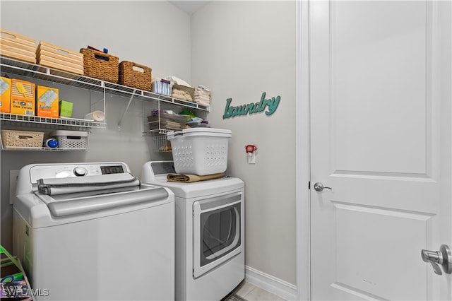 laundry room with separate washer and dryer