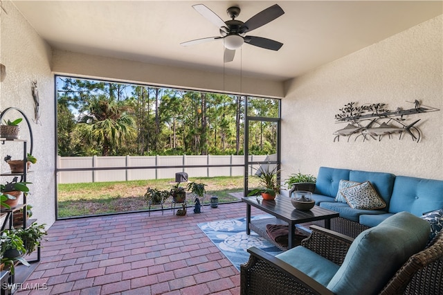 sunroom / solarium with ceiling fan