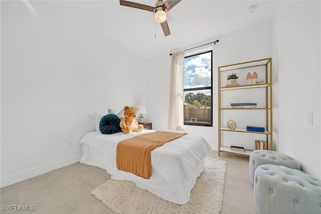 bedroom featuring ceiling fan and lofted ceiling