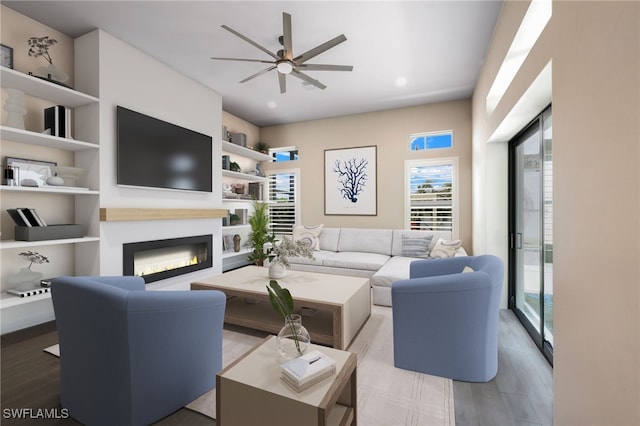 living room featuring ceiling fan, built in features, and light wood-type flooring