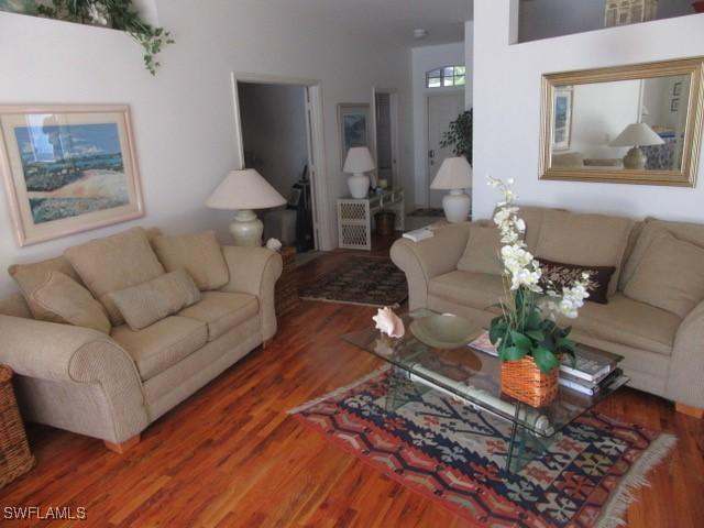 592 Crossfield Cir, Naples, FL 34104 - living area featuring wood finished floors