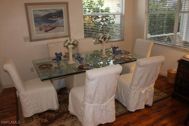 592 Crossfield Cir, Naples, FL 34104 - dining room featuring wood finished floors