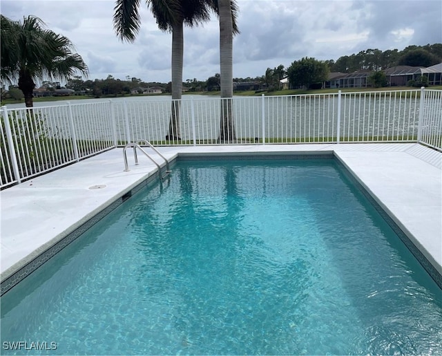 view of pool with a water view