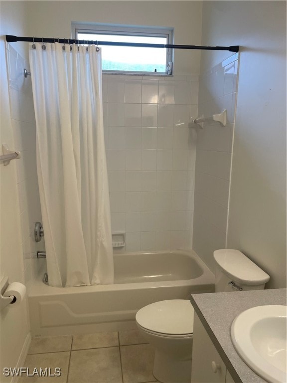 full bathroom with toilet, shower / bath combo, vanity, and tile patterned flooring