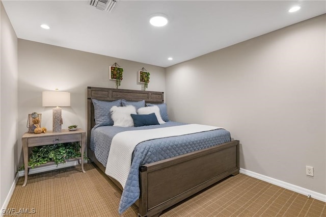 bedroom with light colored carpet