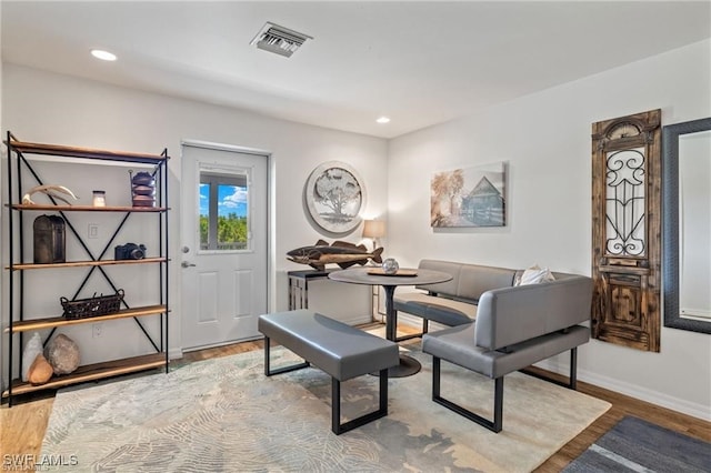 sitting room with hardwood / wood-style floors