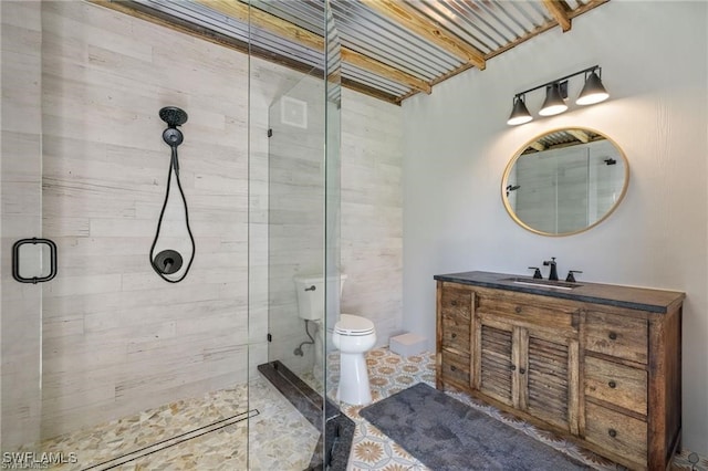 bathroom with toilet, an enclosed shower, vanity, and tile patterned floors