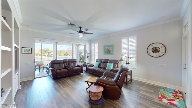 living room with ornamental molding, dark hardwood / wood-style floors, and ceiling fan