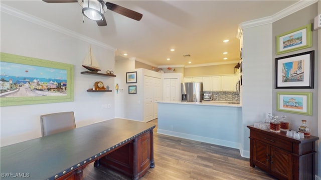 kitchen with dark wood-type flooring, decorative backsplash, stainless steel fridge with ice dispenser, crown molding, and white cabinetry