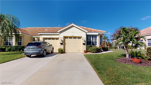 mediterranean / spanish-style home with a garage and a front yard