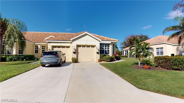 mediterranean / spanish-style home featuring a garage and a front lawn