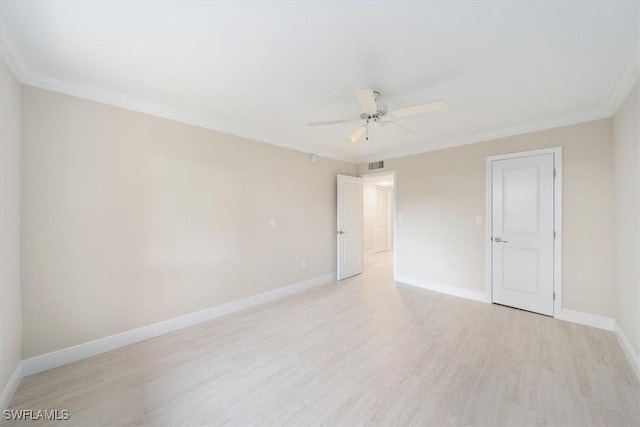 empty room featuring crown molding, ceiling fan, and light wood-type flooring