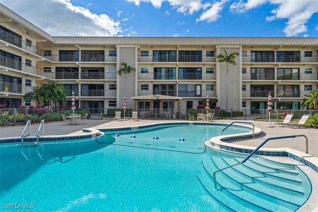 view of swimming pool featuring a patio