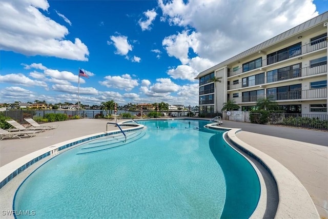 view of swimming pool featuring a patio area