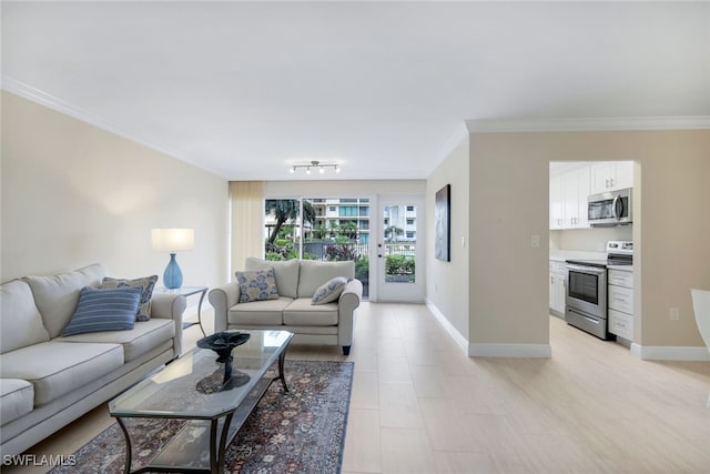 living room with crown molding and rail lighting