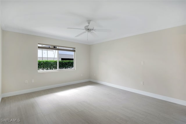 unfurnished room featuring crown molding and ceiling fan