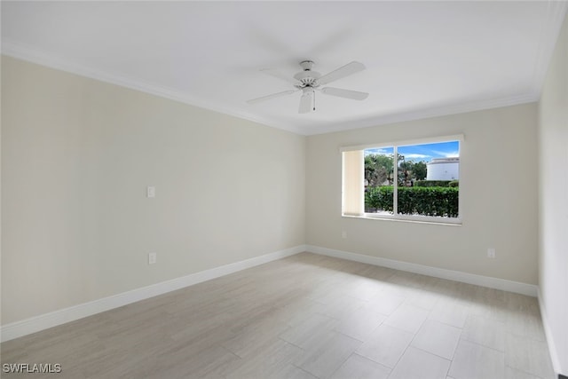 empty room with crown molding and ceiling fan