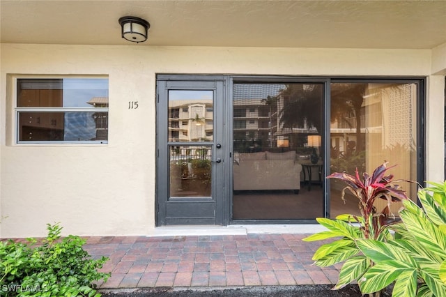 entrance to property featuring a patio