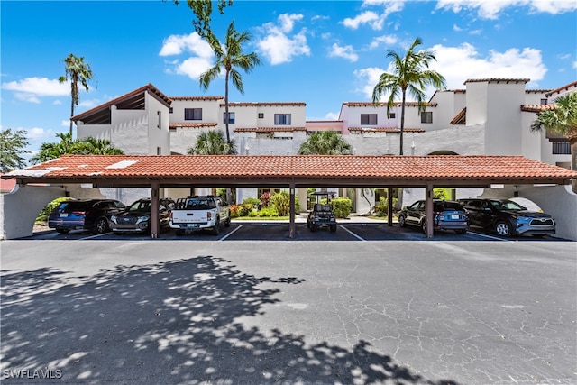 view of vehicle parking with a carport