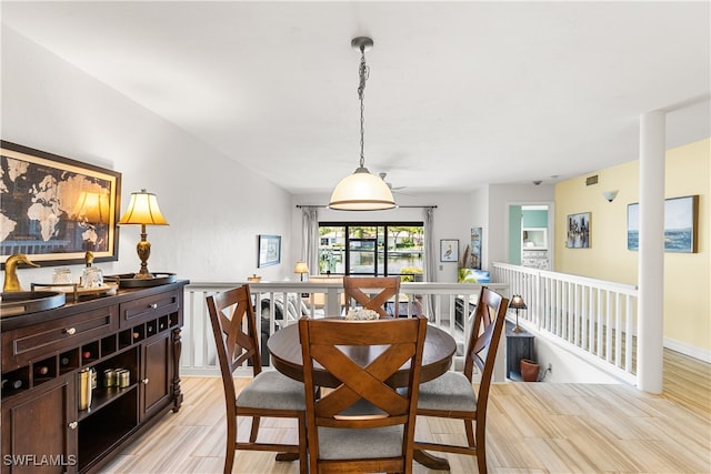 dining space featuring light wood-type flooring