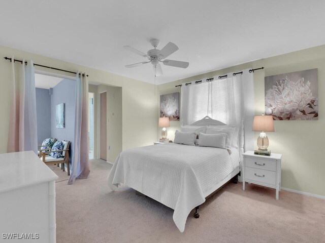 bedroom featuring ceiling fan and light colored carpet