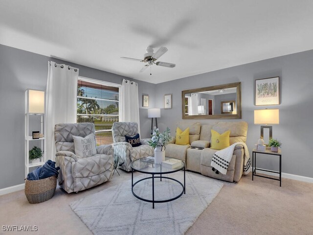 carpeted living room featuring ceiling fan