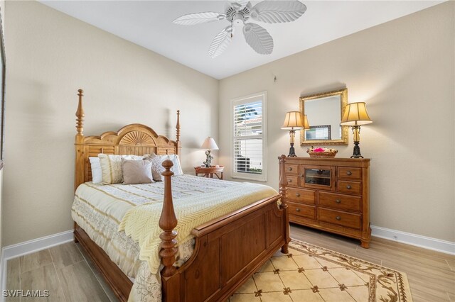 bedroom featuring light hardwood / wood-style flooring and ceiling fan