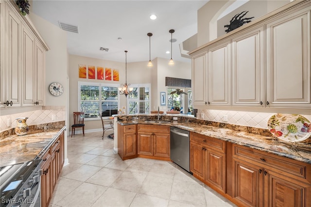 kitchen featuring backsplash, dark stone counters, decorative light fixtures, appliances with stainless steel finishes, and a notable chandelier