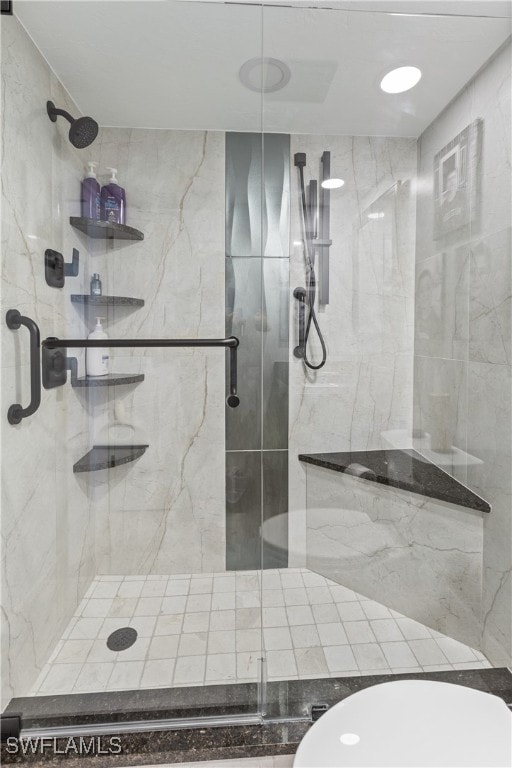 bathroom featuring walk in shower and toilet