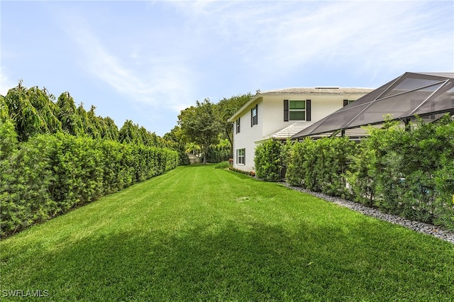 view of yard featuring a lanai