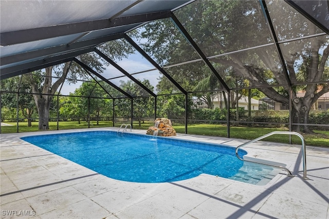 view of swimming pool with a lanai, a lawn, and a patio area