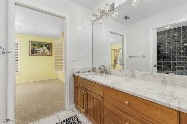 bathroom with vanity and tile patterned flooring