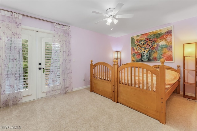 bedroom featuring light carpet, ceiling fan, and access to exterior