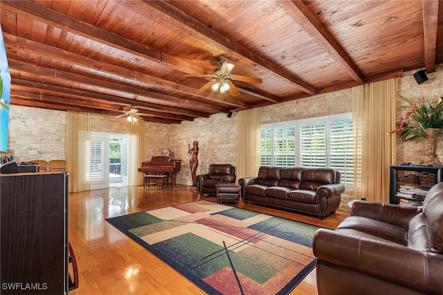 living room with light hardwood / wood-style floors, beam ceiling, ceiling fan, and wooden ceiling