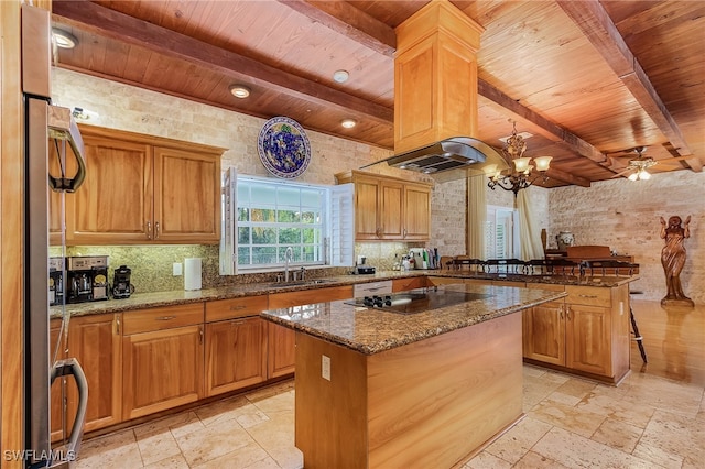 kitchen featuring black electric cooktop, a kitchen island, and wooden ceiling