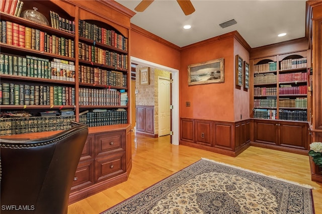 home office with ceiling fan, light hardwood / wood-style flooring, and ornamental molding