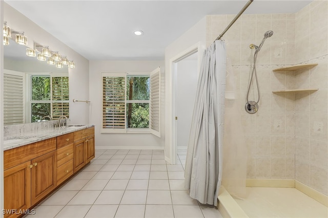 bathroom with vanity, walk in shower, and tile patterned floors