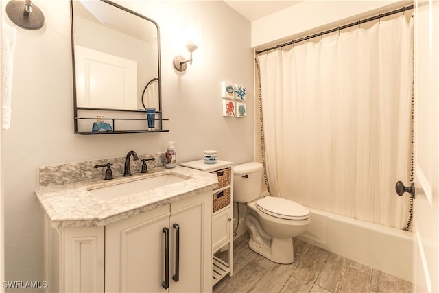 full bathroom featuring toilet, vanity, and shower / bath combo with shower curtain