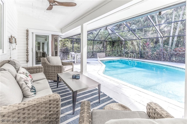 view of pool with ceiling fan, a lanai, an outdoor hangout area, and a patio