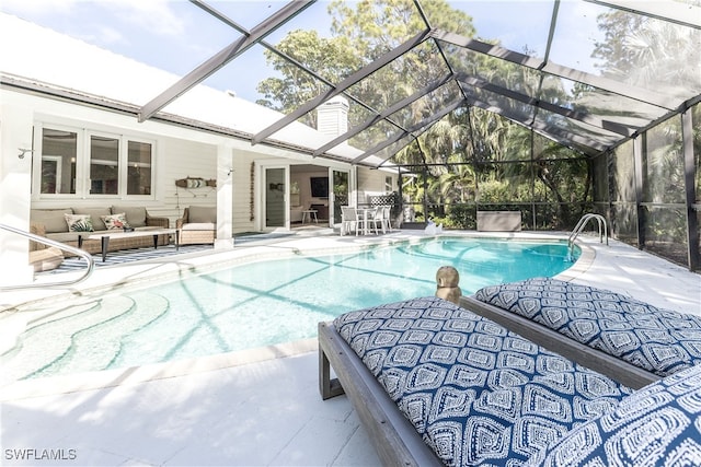 view of pool featuring a patio area, outdoor lounge area, and a lanai