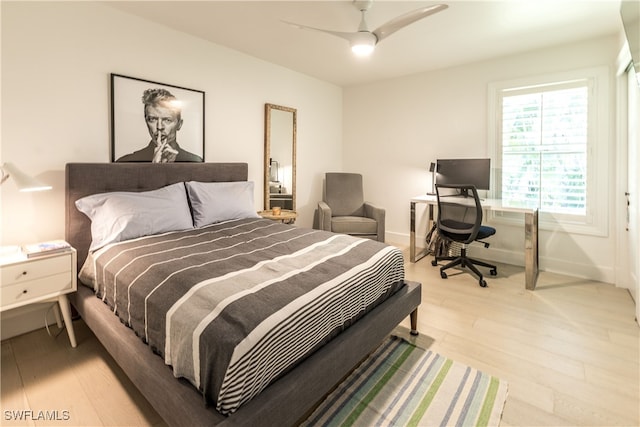 bedroom with ceiling fan and light wood-type flooring