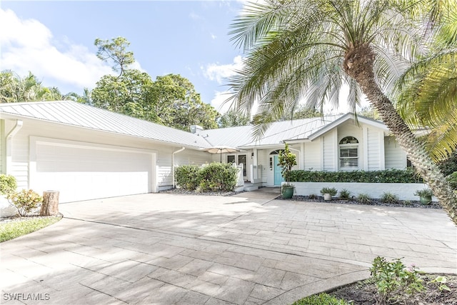 ranch-style home featuring a garage