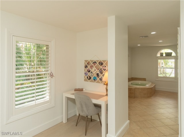 home office with light tile patterned flooring